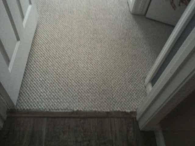 picture of a white hallway carpet after being cleaned